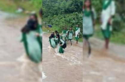 three sides surrounded by rivers life in the middle 30 families of masritari waiting for a bridge children cross river carrying bicycles